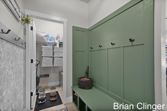 3293 Creek Ridge Dr, Hudsonville, MI 49426 - mudroom featuring light wood finished floors and a wall unit AC