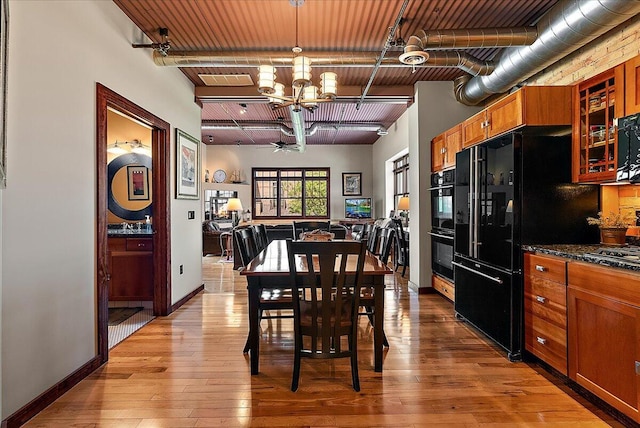 333 State St Unit 5, Saint Joseph, MI 49085 - dining space with a chandelier and hardwood / wood-style flooring