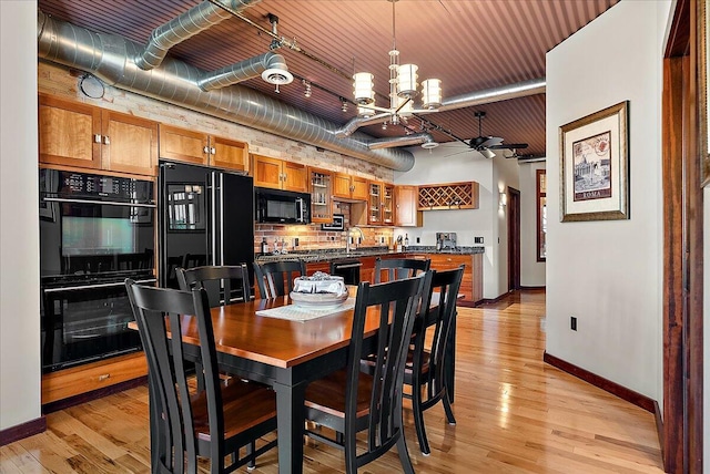 333 State St Unit 5, Saint Joseph, MI 49085 - dining area with a chandelier, light wood-style floors, and ceiling fan