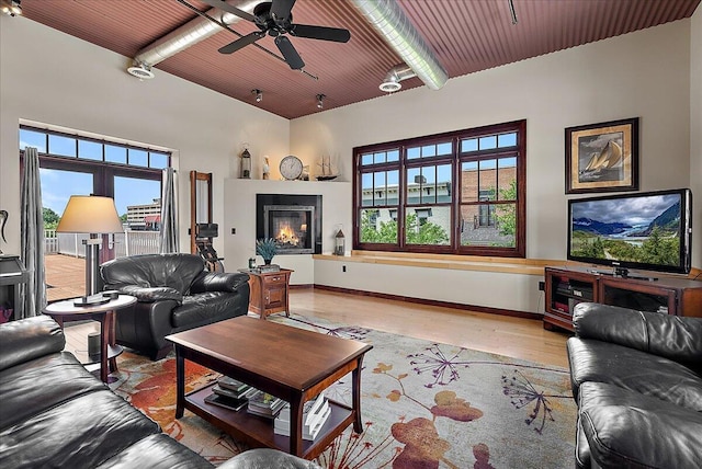 333 State St Unit 5, Saint Joseph, MI 49085 - living room with light wood finished floors, ceiling fan, and a wooden ceiling with exposed beams