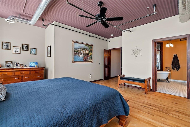 333 State St Unit 5, Saint Joseph, MI 49085 - bedroom featuring wood finished floors, rail lighting, and ceiling fan