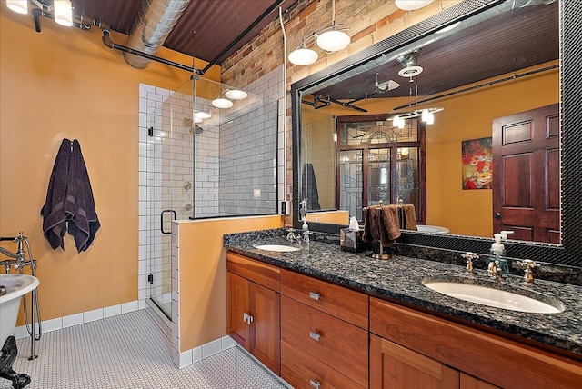 333 State St Unit 5, Saint Joseph, MI 49085 - full bathroom featuring a stall shower and double vanity