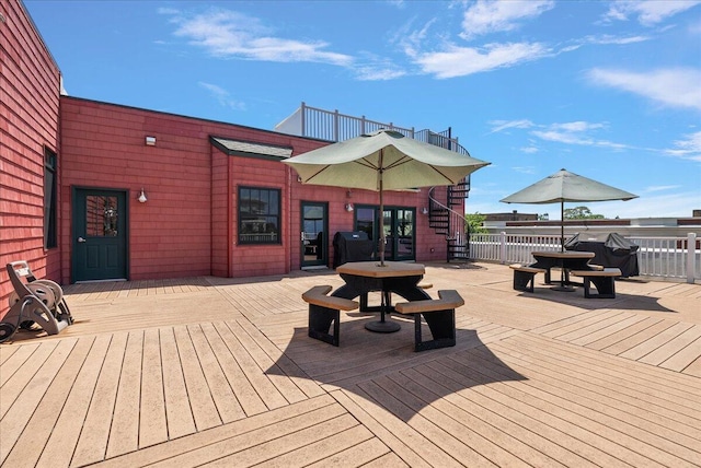 333 State St Unit 5, Saint Joseph, MI 49085 - wooden terrace with stairs, area for grilling, and outdoor dining space