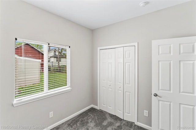 7220 Dodge Ave, Warren, MI 48091 - unfurnished bedroom featuring dark colored carpet and a closet