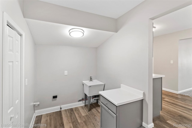 7220 Dodge Ave, Warren, MI 48091 - laundry area featuring dark wood-style floors