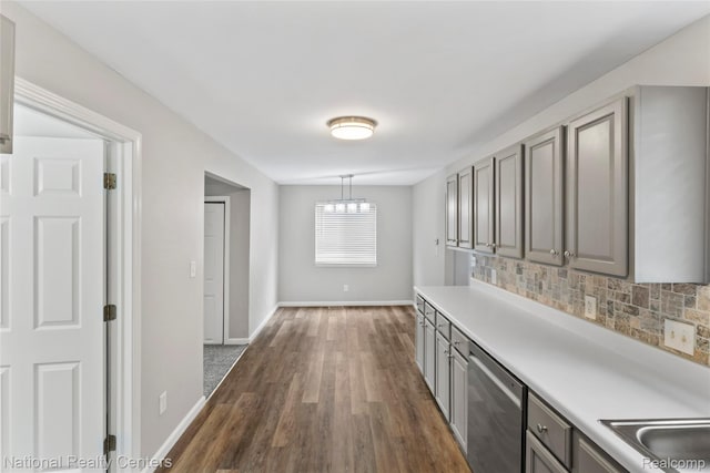 7220 Dodge Ave, Warren, MI 48091 - hall featuring dark wood-type flooring and a chandelier