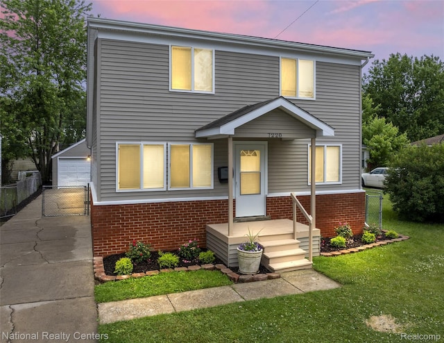 7220 Dodge Ave, Warren, MI 48091 - view of front of property featuring brick siding, a detached garage, and an outdoor structure