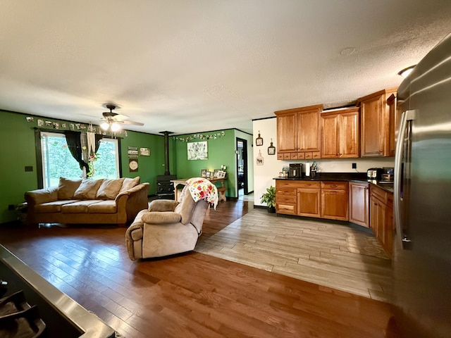 13820 Morenci Rd, Morenci, MI 49256 - living area with light wood-style floors, a ceiling fan, and a textured ceiling