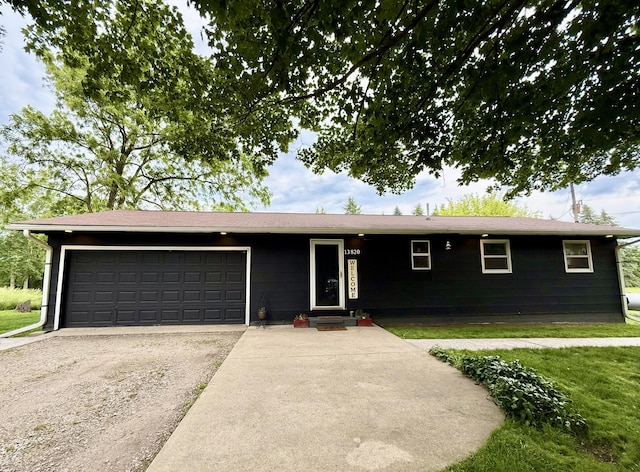 13820 Morenci Rd, Morenci, MI 49256 - ranch-style house with an attached garage and driveway