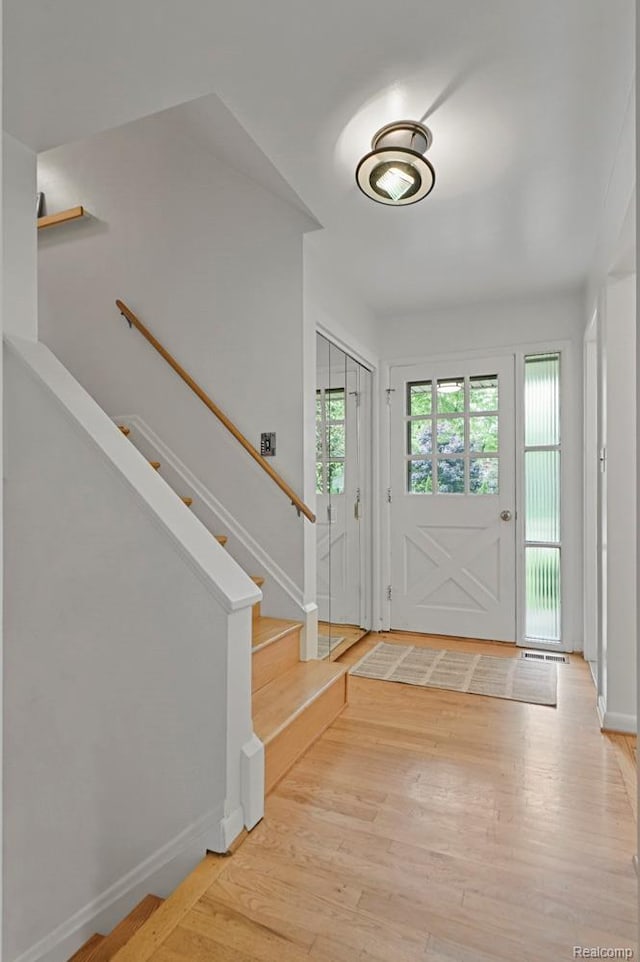 6672 Timber Ridge Dr, Bloomfield Hills, MI 48301 - foyer entrance featuring light wood-style flooring and stairway