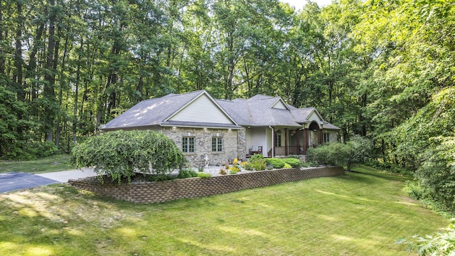 1255 White Pine Dr SW, Grand Rapids, MI 49534 - view of front of property featuring a front lawn, stone siding, and a porch