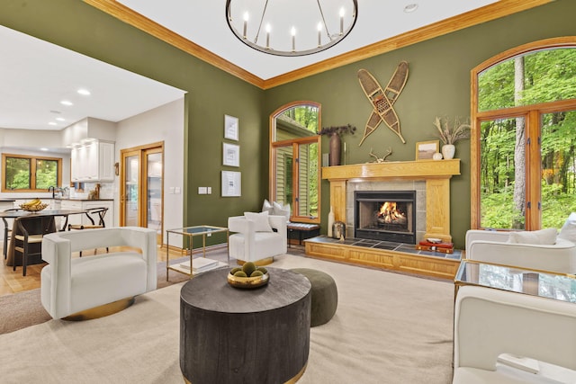 1255 White Pine Dr SW, Grand Rapids, MI 49534 - living room featuring ornamental molding, a tile fireplace, recessed lighting, and a chandelier
