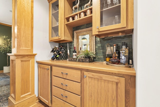1255 White Pine Dr SW, Grand Rapids, MI 49534 - bar with backsplash and light wood-style flooring