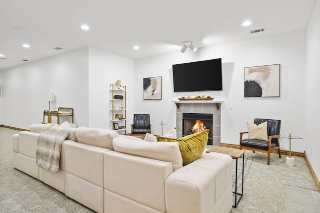 1255 White Pine Dr SW, Grand Rapids, MI 49534 - living area with carpet flooring, a tile fireplace, and recessed lighting