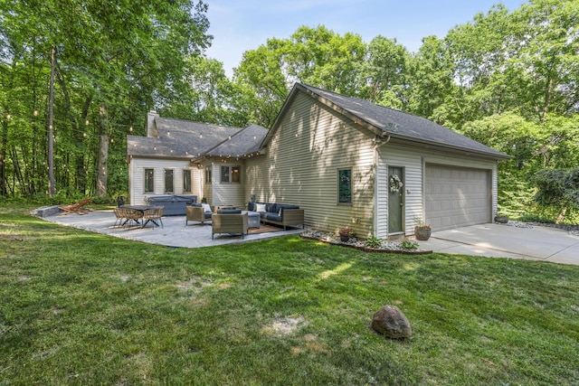1255 White Pine Dr SW, Grand Rapids, MI 49534 - back of property featuring outdoor lounge area, a garage, a patio area, and a lawn