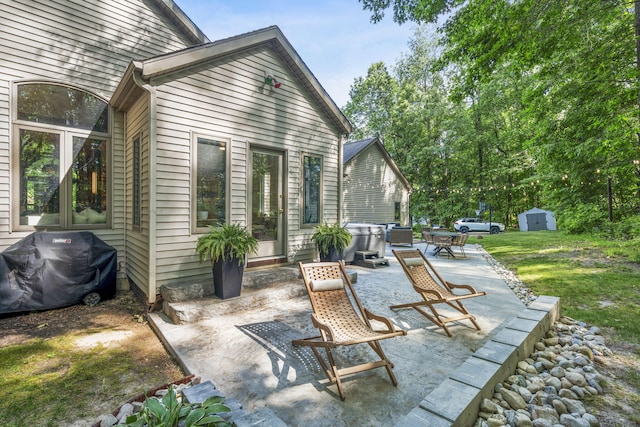 1255 White Pine Dr SW, Grand Rapids, MI 49534 - view of patio featuring area for grilling and a storage shed