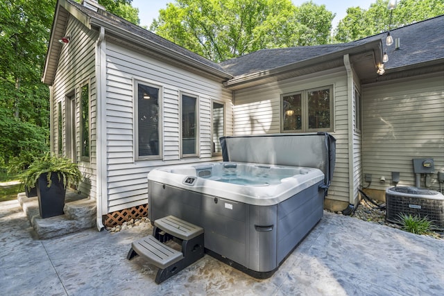 1255 White Pine Dr SW, Grand Rapids, MI 49534 - view of patio featuring a hot tub