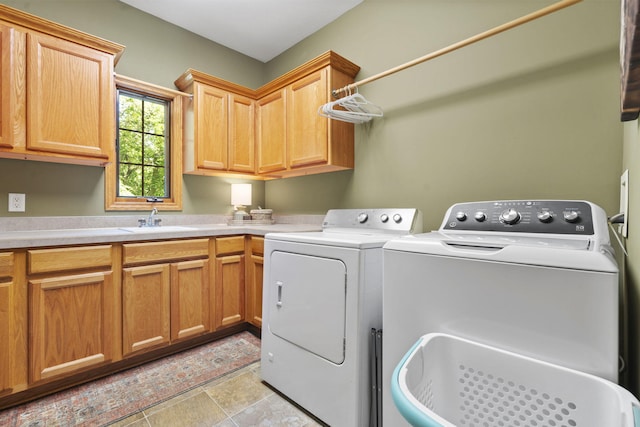 1255 White Pine Dr SW, Grand Rapids, MI 49534 - laundry room featuring washing machine and dryer and cabinet space