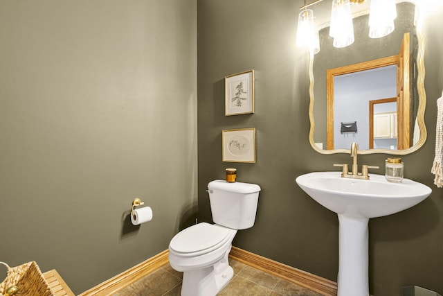 1255 White Pine Dr SW, Grand Rapids, MI 49534 - half bathroom featuring toilet and tile patterned flooring