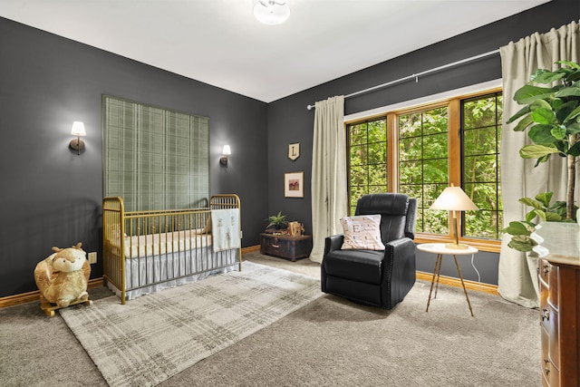 1255 White Pine Dr SW, Grand Rapids, MI 49534 - carpeted bedroom featuring baseboards and a nursery area