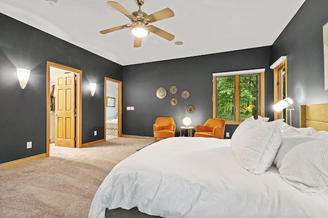 1255 White Pine Dr SW, Grand Rapids, MI 49534 - bedroom with carpet floors, connected bathroom, and ceiling fan
