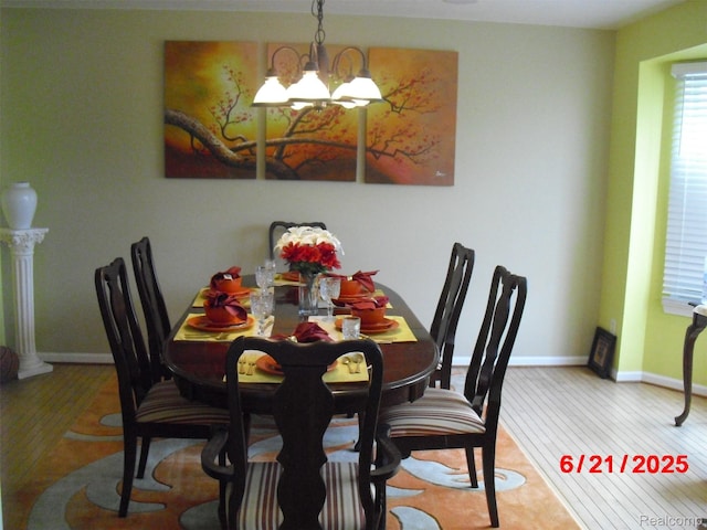 27363 Lilly Ct, Trenton, MI 48183 - dining space featuring a chandelier and light wood-style floors