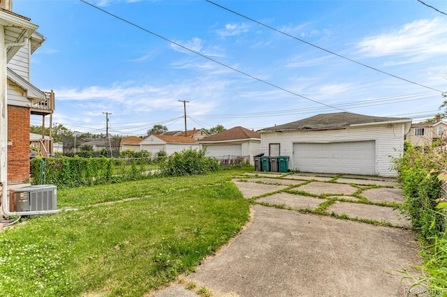 6842 Jonathon St, Dearborn, MI 48126 - view of yard featuring a detached garage and an outbuilding