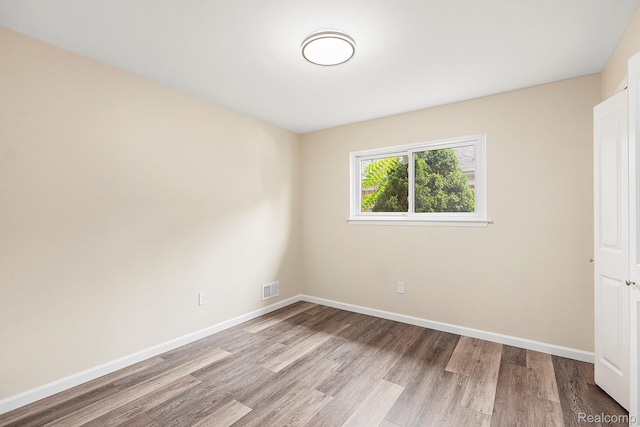 27336 Alger Blvd, Bloomfield Hills, MI 48071 - unfurnished bedroom featuring wood finished floors and baseboards