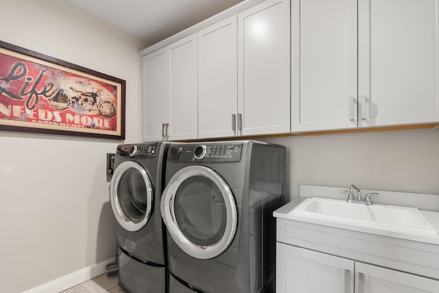 3078 N Spurway Dr, Ann Arbor, MI 48105 - washroom with cabinet space and washer and clothes dryer