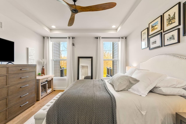 3078 N Spurway Dr, Ann Arbor, MI 48105 - bedroom featuring light wood-style flooring, a raised ceiling, ceiling fan, and recessed lighting