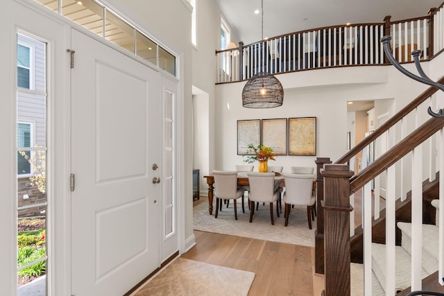 3078 N Spurway Dr, Ann Arbor, MI 48105 - entrance foyer with light wood-style floors, stairs, and a high ceiling
