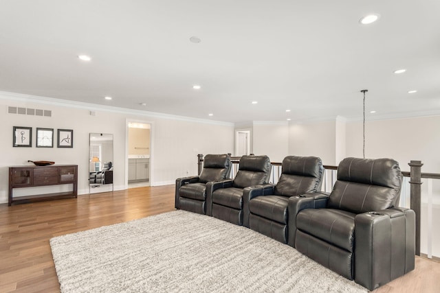 3078 N Spurway Dr, Ann Arbor, MI 48105 - home theater with light wood-style floors, recessed lighting, and ornamental molding