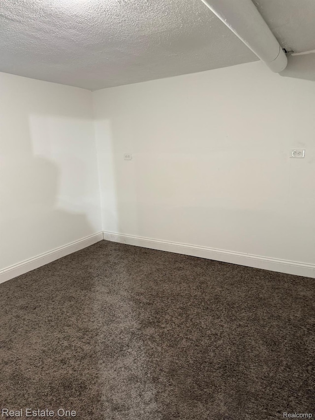6365 Longacre St, Detroit, MI 48228 - spare room with dark carpet and baseboards