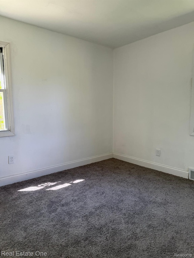 6365 Longacre St, Detroit, MI 48228 - empty room with carpet flooring and baseboards