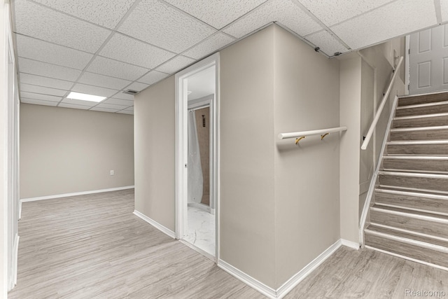 23621 Joy Rd, Redford, MI 48127 - hall with a drop ceiling, wood finished floors, and stairway
