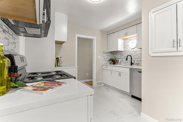 23621 Joy Rd, Redford, MI 48127 - kitchen with light marble finish flooring, stainless steel appliances, decorative backsplash, and white cabinets