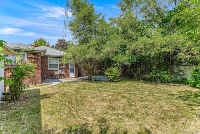 23621 Joy Rd, Redford, MI 48127 - view of green lawn featuring a patio