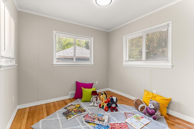 23621 Joy Rd, Redford, MI 48127 - playroom featuring wood finished floors and crown molding