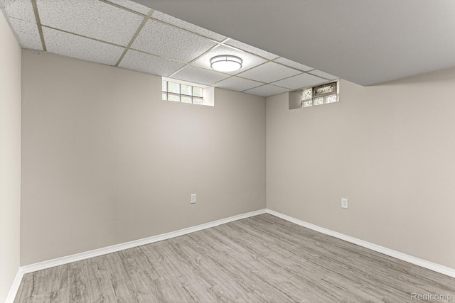 23621 Joy Rd, Redford, MI 48127 - basement featuring a paneled ceiling and wood finished floors