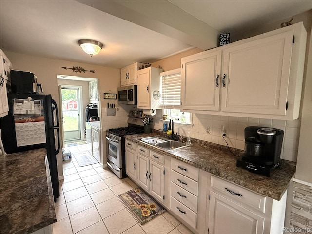 35717 Columbia Ave, Westland, MI 48186 - kitchen featuring stainless steel appliances, plenty of natural light, tasteful backsplash, and white cabinetry
