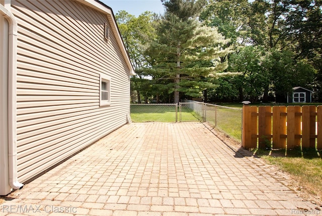 5280 Weston Ct, Commerce Twp, MI 48382 - view of patio featuring view of scattered trees