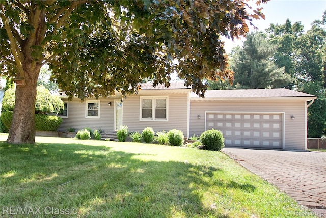 5280 Weston Ct, Commerce Twp, MI 48382 - ranch-style house with a garage, driveway, and a front yard