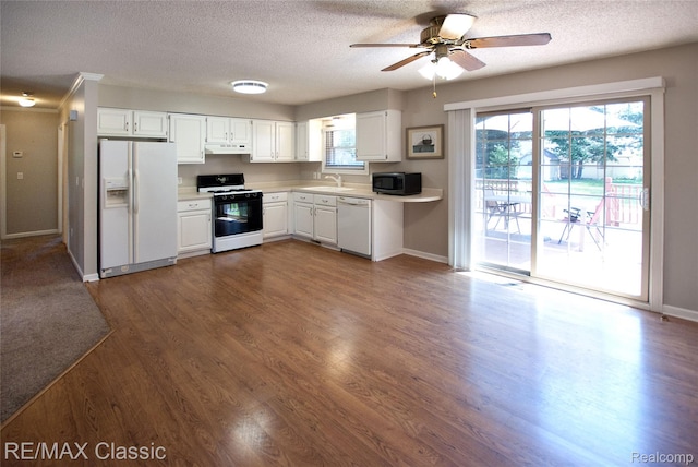 5280 Weston Ct, Commerce Twp, MI 48382 - kitchen with white appliances, light countertops, a textured ceiling, ceiling fan, and under cabinet range hood