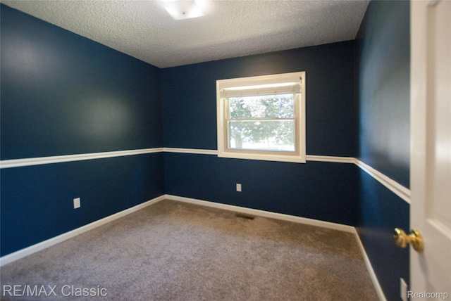 5280 Weston Ct, Commerce Twp, MI 48382 - spare room featuring a textured ceiling and carpet