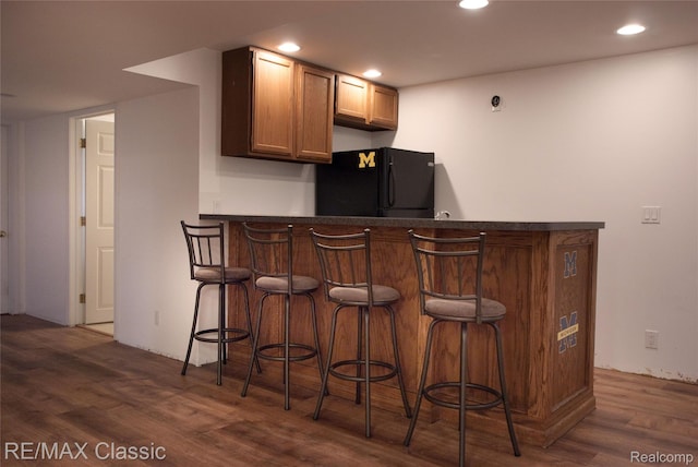 5280 Weston Ct, Commerce Twp, MI 48382 - indoor dry bar with freestanding refrigerator, dark wood finished floors, and recessed lighting