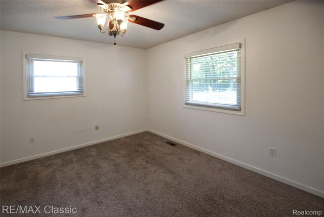 5280 Weston Ct, Commerce Twp, MI 48382 - carpeted empty room with plenty of natural light, ceiling fan, and a textured ceiling