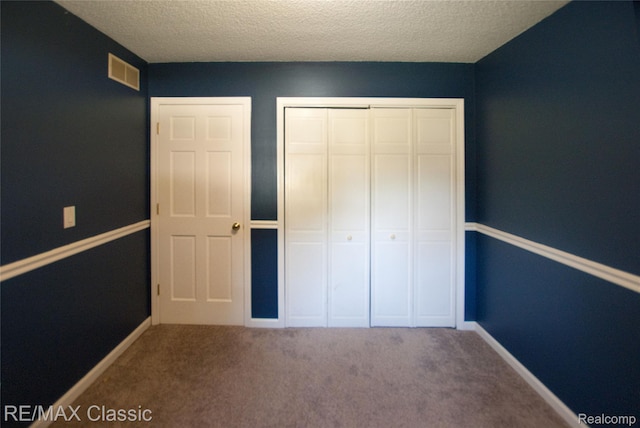 5280 Weston Ct, Commerce Twp, MI 48382 - unfurnished bedroom with a closet, a textured ceiling, and carpet