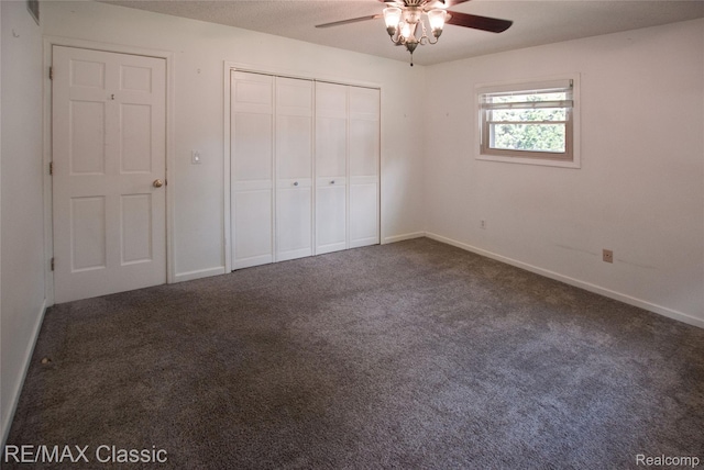 5280 Weston Ct, Commerce Twp, MI 48382 - unfurnished bedroom with dark carpet, a closet, and ceiling fan