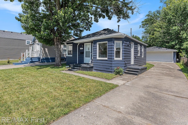 23736 Mac Arthur Blvd, Warren, MI 48089 - view of front of property featuring a front yard, an outbuilding, and a garage