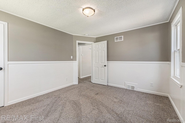 23736 Mac Arthur Blvd, Warren, MI 48089 - spare room with a textured ceiling, carpet floors, and crown molding
